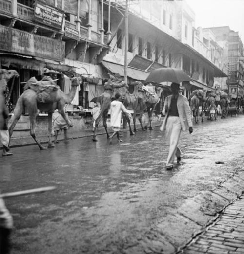 Cecil Beaton, The shopping centre of Benares in a downpour of rain..., 1940s