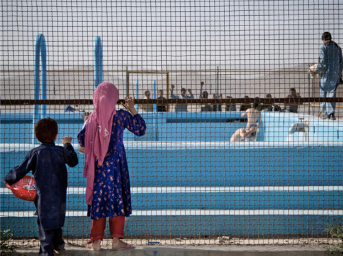 Children peer through a fence that surrounds a swimming pool on a hill overlooking Kabul on May 17. The swimming pool built by the Soviets more then 30 years ago has rarely been used.
http://slideshow.nbcnews.com/slideshow/news/afghanistan-nation-at-a-crossroads-34923291/