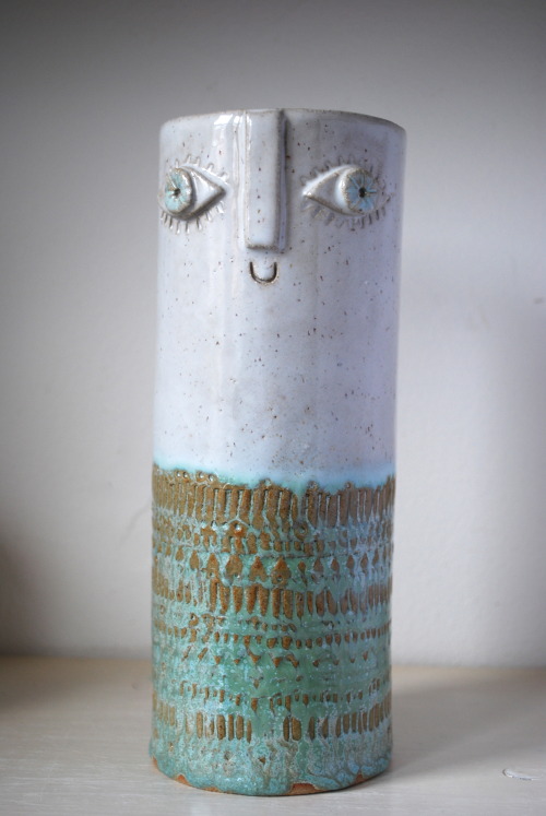 Atelier Stella. Tall happy faced vase.