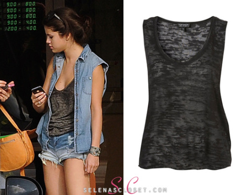 Selena was photographed wearing this Topshop Burnout Low Armhole Vest last week, while hanging out on the set of Spring Breakers. It&#8217;s currently on sale for $20.00. <br /> Buy it HERE. <br /> A big thanks to officialmaddy for sending this in! <br /> She wore this top with Blank NYC Hi Rise Shorts and the American Apparel Canyon Rock Bag. We&#8217;re still looking for her denim vest.