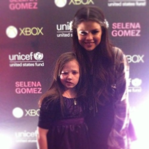 Selena with a fan at her Unicef concert M&G