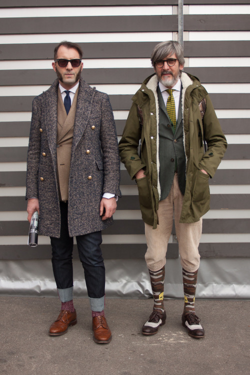 wgsn:

Smartened-up outdoor #menswear styling live from the #Pitti Uomo trade show in Florence
WGSN street shot, Pitti Uomo autumn/winter 2014/15
