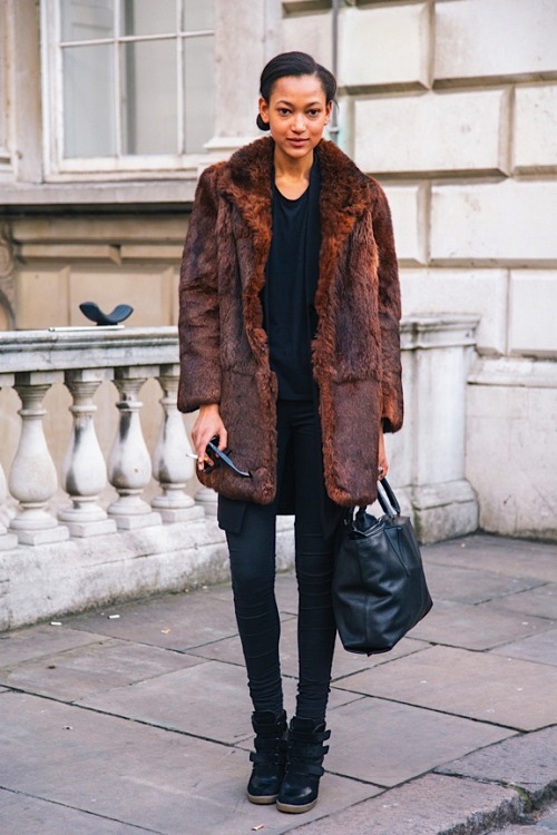 A classic fur coat and a pair of high-tops mash up slick elegance with sport. 
