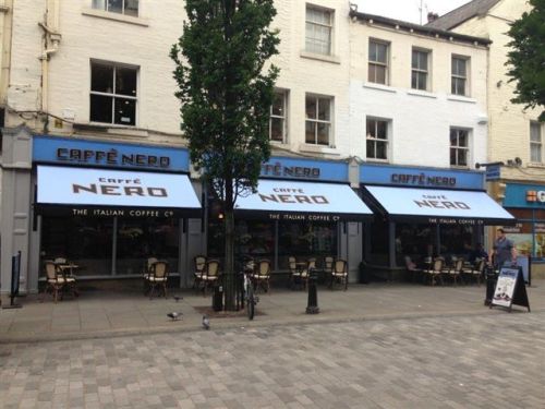 Newly refurbished site; new recovers on traditional awnings at Caffe Nero in Halifax, July 2013.