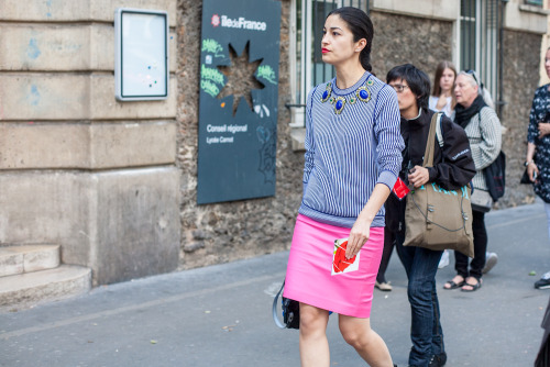 A pink skirt and a blue knit make for a winning style combo.