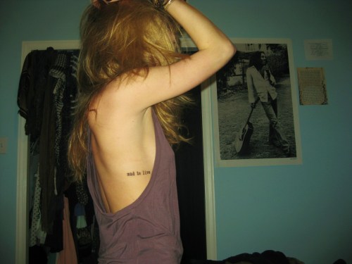 Two of Emma's tattoos: “Mad to live” from the kerouac quote (“The only 