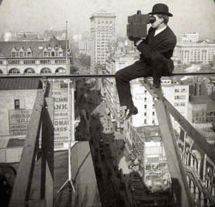 Reaching for the Out of Reach 12: Photographer 18 stories above Fifth Avenue, New York City, 1906. [ more from this project (info) ]