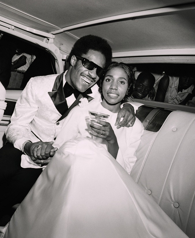 vintageblackglamour:  Stevie Wonder and his first wife, the brilliant singer and songwriter Syreeta Wright (1946-2004) as they celebrate their wedding day on September 12, 1970. Ms. Wright co-wrote “Signed, Sealed, Delivered, I’m Yours” and “If You Really Loved Me” with Mr. Wonder and recorded “With You, I’m Born Again” with Billy Preston in 1979. The newlyweds are seen as they leave Bernette Baptist Church in Detroit en route to their reception. They honeymooned in Bermuda. Photo: Bettman/Corbis.
