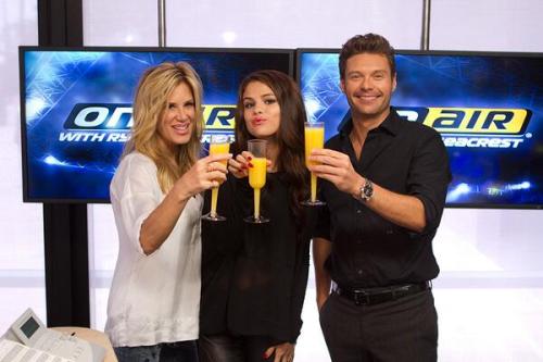 Selena sharing a birthday mimosa with Ryan and Ellen