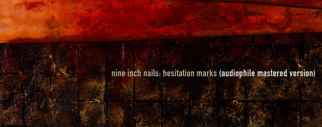 Hesitation Marks was mastered in two different ways - the standard, &#8220;loud&#8221; mastering (which is what you&#8217;ll find on the CD, on iTunes, and everywhere else), and also an alternate &#8220;audiophile&#8221; mastering, which we&#8217;re offering as a free download option for anyone who purchases the album through nin.com. For the majority of people, the standard version will be preferable and differences will be difficult to detect. Audiophiles with high-end equipment and an understanding of the mastering process might prefer the alternate version.  Alan Moulder, who mixed the album, offers a more detailed explanation:  When we were mixing Hesitation Marks we decided to treat the mastering process in a slightly different way to the usual. Since we had tried to treat every other aspect of making this record differently to how we were used to, it seemed to make sense. We were mixing as we went along with the production of each song rather than at the end, so we thought that once we had a song pretty close we would send it off to Tom Baker, our long time serving mastering engineer, to give it some mastering treatment. Normally you wait until the record is finished being recorded and mixed, then take all the mixes to mastering. But we thought doing it again, as we went along, might make us push the process further and spend more time on mastering rather than rush through it at the end. Whilst doing this we became aware of how much low bass information there was on the record. Since that can define how loud of a level the mastering can be, we were faced with a dilemma: do we keep the bass and and have a significantly lower level record, or do we sacrifice the bass for a more competitive level of volume? The biggest issue in mastering these days tends to be how loud can you make your record. It is a fact that when listening back-to-back, loud records will come across more impressively, although in the long run what you sacrifice for that level can be quality and fidelity. So after much discussion we decided to go with two versions. On the main release Tom did exceptional work to maintain the integrity of our mixes and reproduce the low end as much as possible and still get a decent level, although it&#8217;s still nowhere as loud as a lot of modern records. The Audiophile Mastered Version is more true to how the mixes sounded to us in the studio when we were working on the songs. Have a listen, turn up the volume and enjoy the experience!   Mastering Engineer Tom Baker adds:   I believe it was Trent&#8217;s idea to master the album two different ways, and to my knowledge it has never been done before.  The standard version is &#8220;loud&#8221; and more aggressive and has more of a bite or edge to the sound with a tighter low end. The Audiophile Mastered Version highlights the mixes as they are without compromising the dynamics and low end, and not being concerned about how &#8220;loud&#8221; the album would be. The goal was to simply allow the mixes to retain the spatial relationship between instruments and the robust, grandiose sound.     NOTE: The standard mastered version is in no way inferior to the Audiophile Version - we wouldn&#8217;t release something inferior as the default. And vinyl purists rest assured, the vinyl edition was mastered to sound the very best for that format. The Audiophile Version is merely an alternate take on the mastering, which some people will appreciate. It&#8217;s meant to give a slightly different experience, not denigrate the standard version. Listen to each and come to your own conclusions.   If you ordered any format of Hesitation Marks from nin.com, you&#8217;ll be able to download one or both mastering versions, in whichever formats you prefer (MP3, FLAC, Apple Lossless, and WAV), beginning September 3rd.