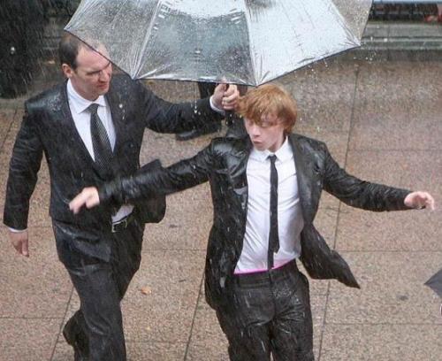 This picture of Rupert Grint dancing in the rain at the Harry Potter 