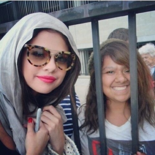 Selena taking a photo with a fan earlier today!