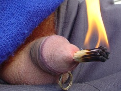 Hello,  On this never publisched and original picture It&#8217;s cold outside for my sub, but this Dutch Mistress has found a way to warm him.  Is it the heat of the flames or the fear for the flames? Only he knows!
