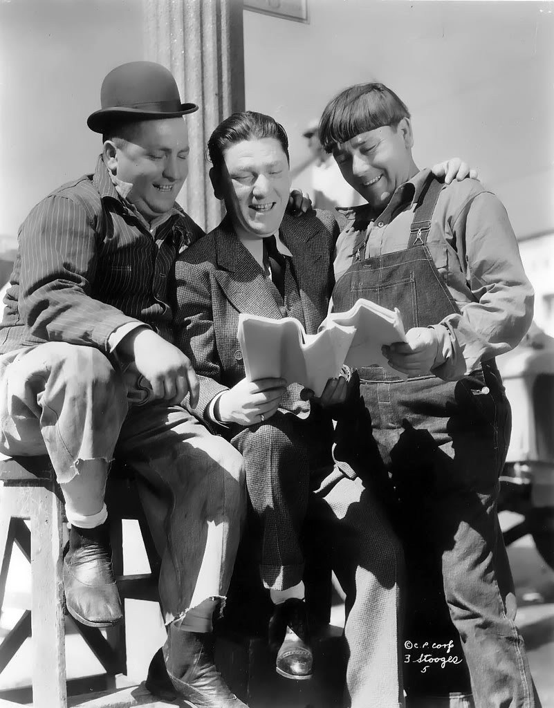 Three of the six Three Stooges read.