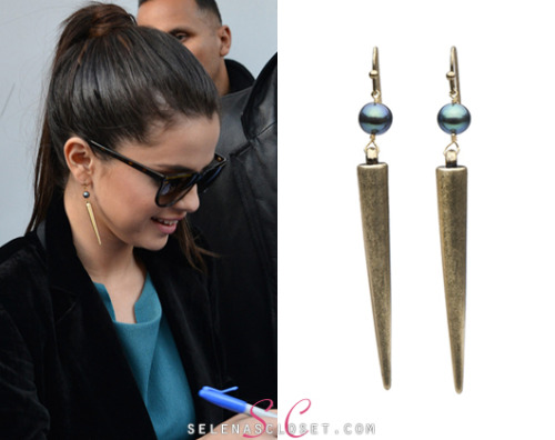 Cameras snapped Selena Gomez looking chic in Paris wearing a pair of Pearl Collective Black Freshwater Pearl Spike Earrings. These earrings are on sale for $150.00. <br /> Buy them HERE <br /> Thanks loveme-fearlessly! <br /> She&#8217;s also wearing an Emporio Armani coat, Casadei pumps and A.L.C pants. We&#8217;re still looking for her sunglasses and top