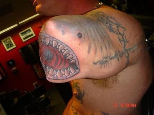 shark bite tattoo. I love how the shark tattoo