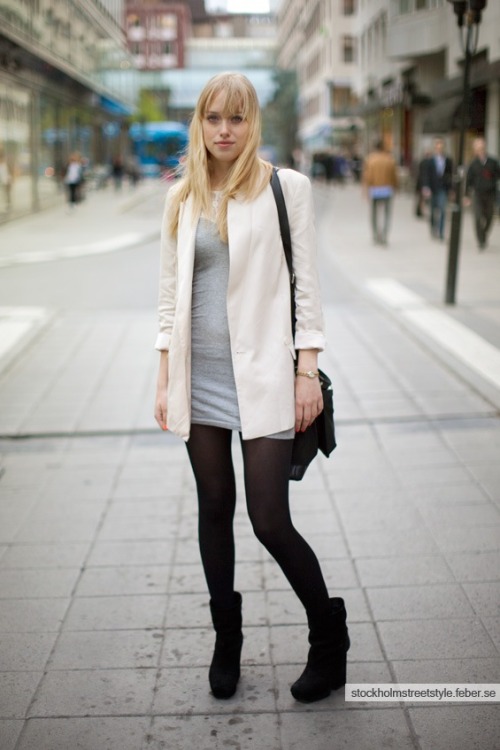 White coat, grey dress, black tights and boots.