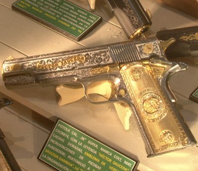 John Dickie gold and silver Versacelogoencrusted Mexican druglord pistol 