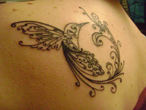 Hummingbird on my left shoulder blade. It is my first tattoo. Done by Todd