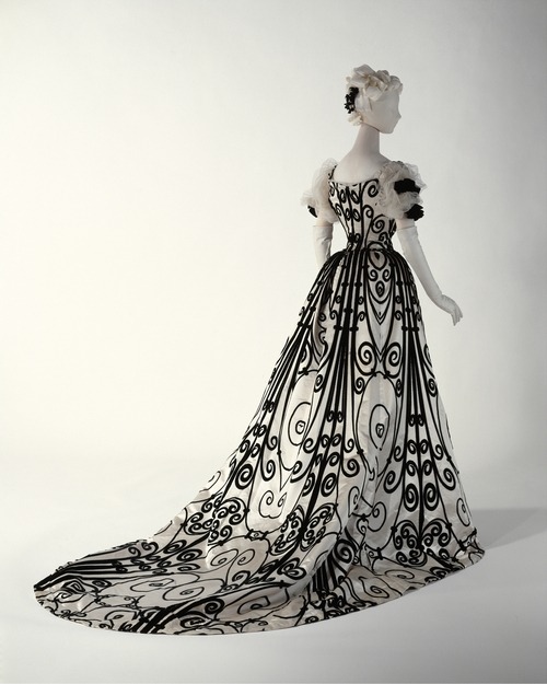historicalfashion:  defunctfashion:  House of Worth | c. 1898-1900 This is probably Charles Frederick Worth’s most iconic design. It shows the influence of the Art Nouveau movement at the turn of the century. The velvet scroll design is very similar to the wrought iron designs found on Parisian architecture of the era.  Detail    FAVOURITE
