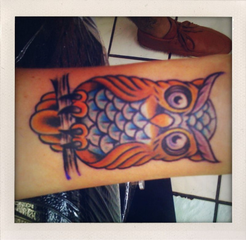 Really great owl tattoo