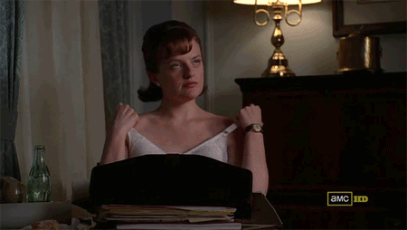 Peggy Olson strips out of her bra defiantly.