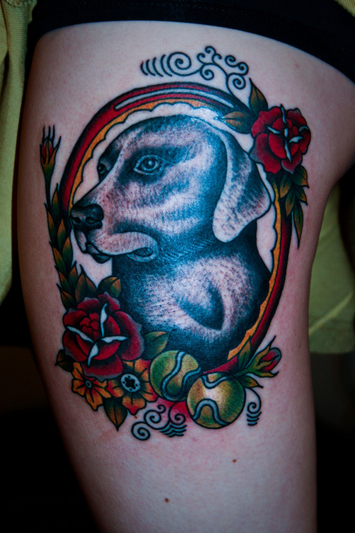 I did this dog tattoo tonight he has 2 tennis balls and a few roses in 