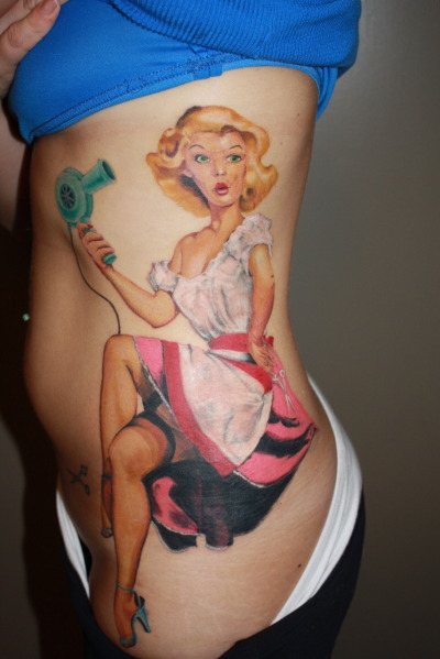 This is my newest tattoo (and biggest) that I got about 4 months ago. I love the 1940 and 50’s style and I am a hairstylist so I got my pinup to be holding a blow dryer and scissors.