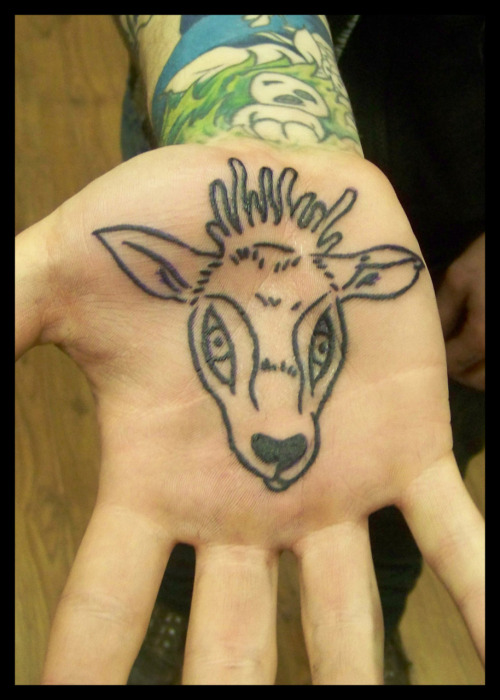 Deer palm tattoo done by Spike