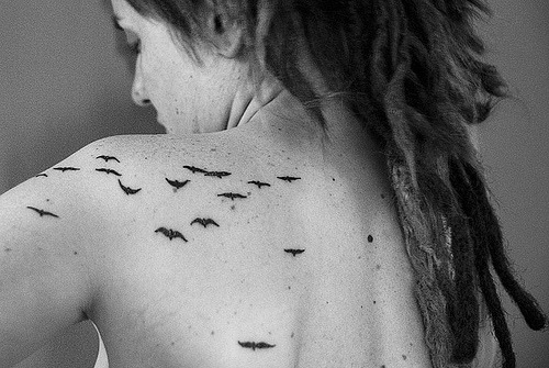 tagged as tattoo bird tattoo bird dread dreadlocks girl
