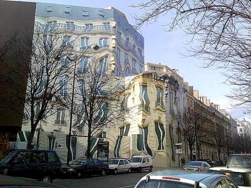This surreal building actually exists at 39 Avenue George V, Paris.