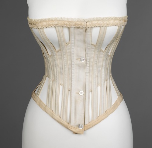 Lightweight summer corset ca. 1871 via The Costume Institute of The Metropolitan Museum of Art “This skeleton-like corset is unique in form, for it is lighter and less restricting. The open spaces make it a cooler and comfortable choice for warmer weather. Most likely, this corset would be worn with casual day wear, due to its simplicity, the only detail being the lace trim at top.”