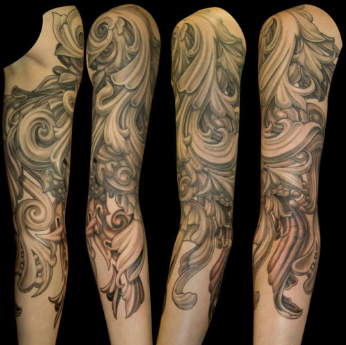 This almost fullsleeve of organic'filigree' work is on a fellow artist