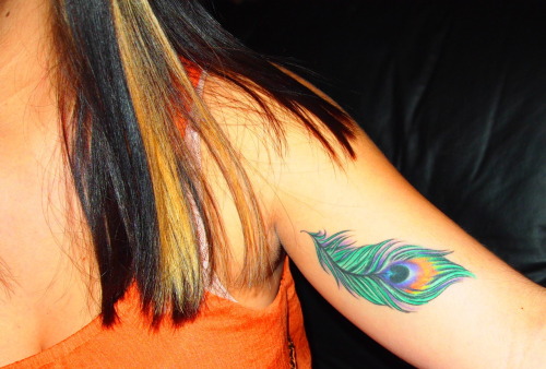 This is my peacock feather tattoo located on my left bicep