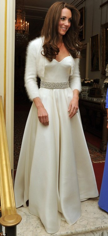 dirtyprettything:  Catherine, Duchess of Cambridgeshire wearing another Sarah Burton creation, this time a white satin evening dress with a circle skirt and diamante embroidered detail round the waist.   