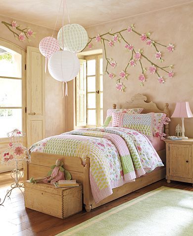 Draw the branches and then simply add the pretty paper flowers (any kind you like) on the wall&#8230;