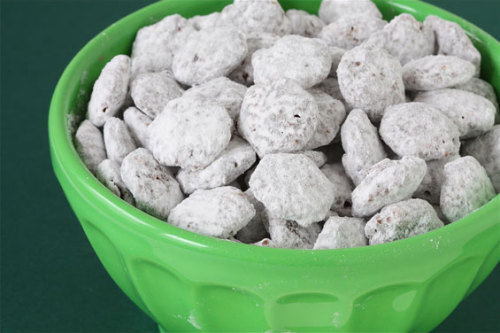 Sweet things are my weakness and I LOVE puppy chow!  I think I might try this using PB2 as a sub for peanut butter
undressedskeleton:

Kitty Chow!
Calories- 100 Total Carbs- 18 Fat -2g Fiber-5g Protein- 2
You know that Puppy chow stuff that is really yummy!? Well it’s also 365 calories a cup! So here is my version but its only 100 calories!
Makes 4 Servings
Ingredients:
2 Cups Fiber one Honey Squares
4 Tablespoons “I can’t believe it’s not butter”
2 Tablespoons Creamy All Natural Peanut Butter
2 Servings Truvia all Natural Sweetener.
1 Package of Fat Free Sugar Free Vanilla Pudding Mix
2 Squares of Reduced Fat Chocolate Almond Bark
Directions
In a large mixing bowl melt butter, chocolate almond bark and  peanut butter. (I used the microwave)
After melted pour cereal into mixture. Stir gently
Let the mixture cool for a good 20 minutes.
After mixture has hardened pour the mix into a large zip lock bag, add the box of pudding mix and shake gently until coated.
