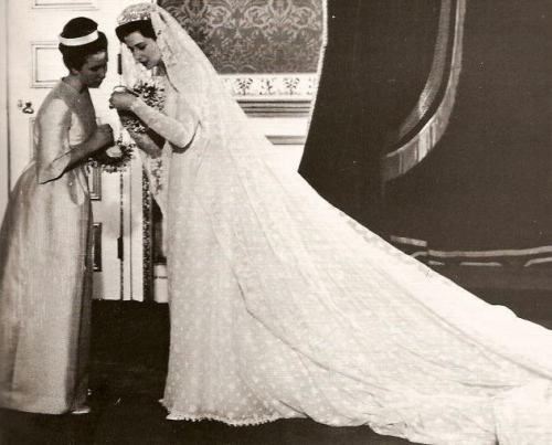 Princess Alexandra of Kent in her wedding gown and veil with her bridesmaid