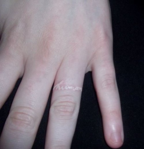 fuckyeahtattoos : White ink ring finger tattoo; ‘human’ in my 