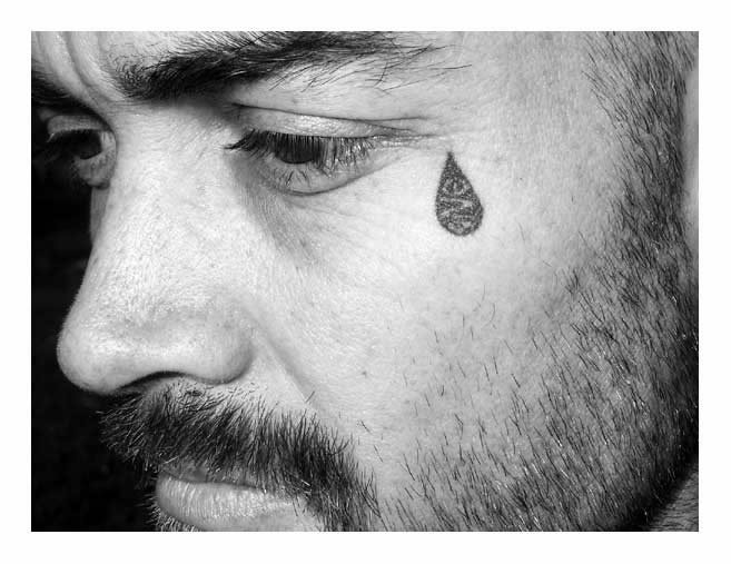 The teardrop tattoo or tear tattoo is a symbolic tattoo that is placed underneath the eye. The meaning is that the wearer had killed someone, been incarcerated or lost a loved one.