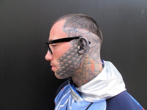 Geometric facial tattoo