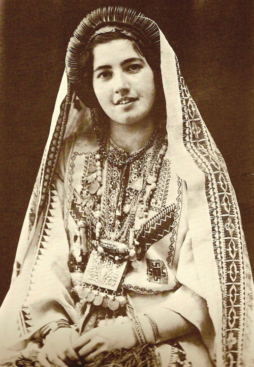 Ruth Raad in the traditional costume of Ramallah, circa 1943. Khalidi, Walid. Before Their Diaspora: A Photographic History of the Palestinians 1876-1948. Washington D.C.: Institute for Palestine Studies, 1991.
