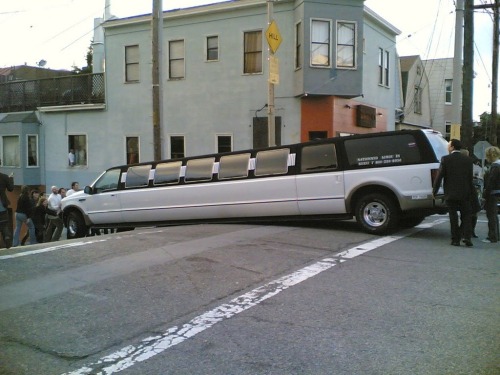 Stretch limo stuck on hill.