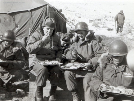 
Eisenhower in Korea
President Eisenhower and Sargent Virgil Hutcherson, Squad Leader, Co. “B”, 15th Infantry Regiment, 3rd US Infantry Division, eat dinner in Korea.  December 4, 1952.

