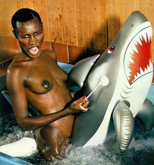  8220This is a picture of Grace Jones naked riding an inflatable shark