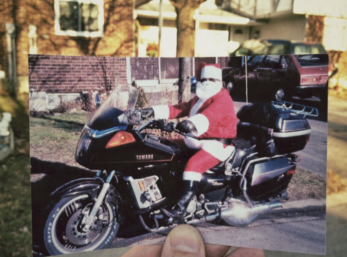 Dear Photograph,
Over 20 years ago my father rode his bike around town at Christmas and made people happy! Today I hopped on my Harley and got the chance to continue this tradition. I got to spread lots of Christmas cheer, posing for photos, handing out Tim Horton&#8217;s gift cards and making people smile! Merry Christmas Dad, I&#8217;m glad to follow in your footsteps!
Jesse 