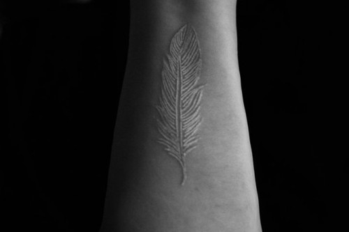 i will be getting a white ink feather tattoo most likely on my wrist within