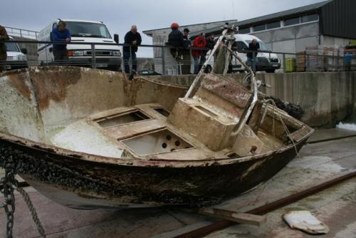 boston:    Ghost boat found after three-year, 3,500-mile journey  - After wandering the sea for more than three years, the Queen Bee out of Nantucket was found 20 miles off the northern coast of Spain.  (US Coast Guard photo)  