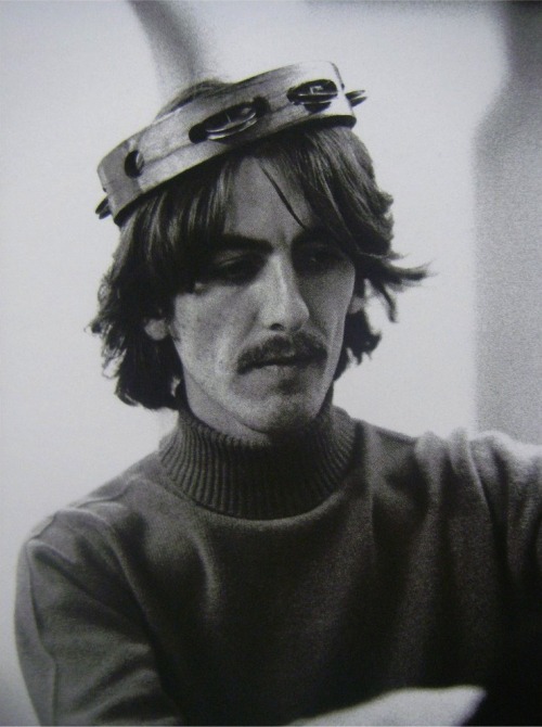 jai-guru:

“I was never quite sure whether George Harrison liked me taking pictures of him, because he usually had such a serious face. But one day he saw me pointing my camera at him, and he started hamming it up by putting tambourines on his head, so I guess he didn’t mind.”

- Linda McCartney