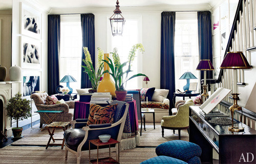 The navy blue turquoise mustard and plums create a rich color palette